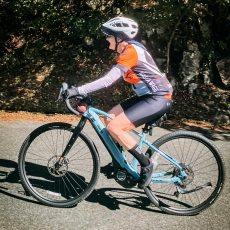 smiling guest cycling on Shogun odyssey