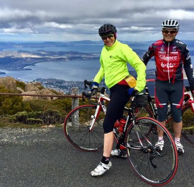 Doug Bruce and Dianne Batten on bikes at top of Kunanyi