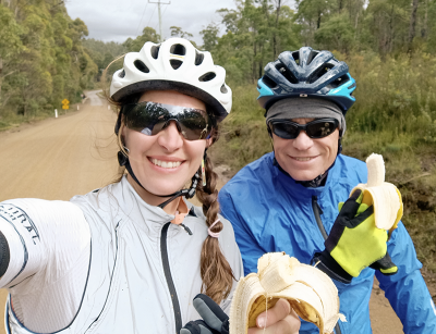 Mike's Vlog - Mike Siers Mike Siers and Isabel Hofman on a gravel road in tasmania eating bananas