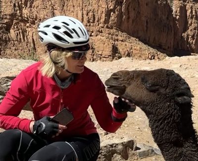 Nikki Baker and Camel in Morocco on bike tour